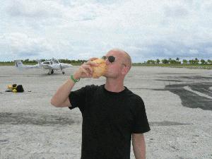 Drinking a refreshing coconut before take off.